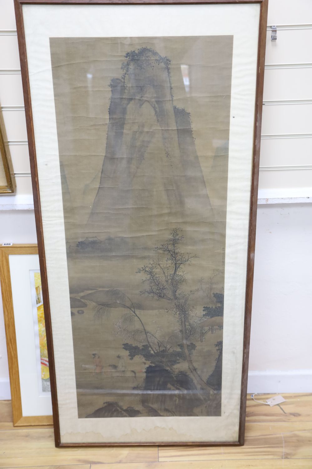 A Chinese watercolour on silk, Travellers passing a mountain peak, 120 x 48cm